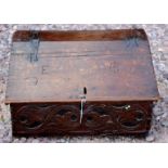 A rare mid 17th Century 'Devon' carved oak boarded desk box with original polychrome decoration,