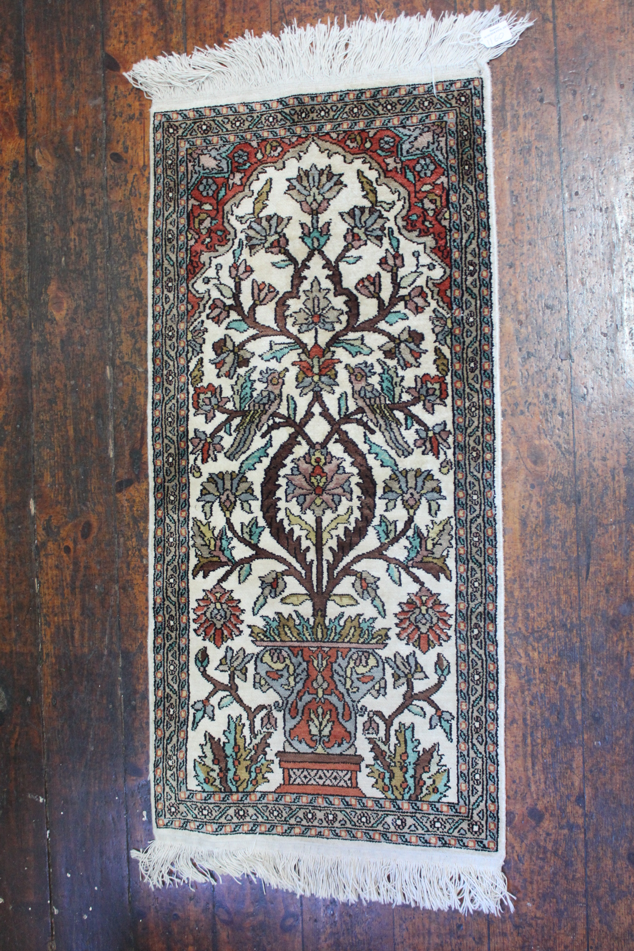 A Chinese pure silk pile rug with birds,