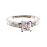 A diamond solitaire ring, the princess cut diamond weighing approx 1.