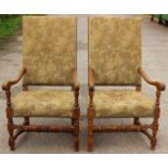 A pair of Carolean style oak joined open armchairs, with Autumnal upholstery to backs and seats,