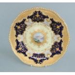 A Coalport cabinet plate, cobalt blue ground with raised gilding,