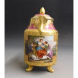 A Vienna hot water jug and cover, with raised gilding over a claret and pink ground,