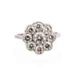 A diamond flower head cluster 18ct white gold ring,