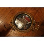 A Regency giltwood girandole, with original convex plate with ebonised slip,