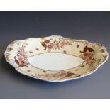 A Spode dessert dish, cream ground decorated with flowers leaves and insects and gilding,