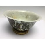 A Chinese porcelain bowl, mottled glaze over a crackle ground, ormolu foot mount, diameter 16cm (s.
