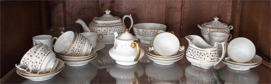 A 19th Century part tea service and tea pot with milk jug and sugar basin, with floral border and