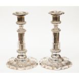 A pair of silver plated telescopic candlesticks