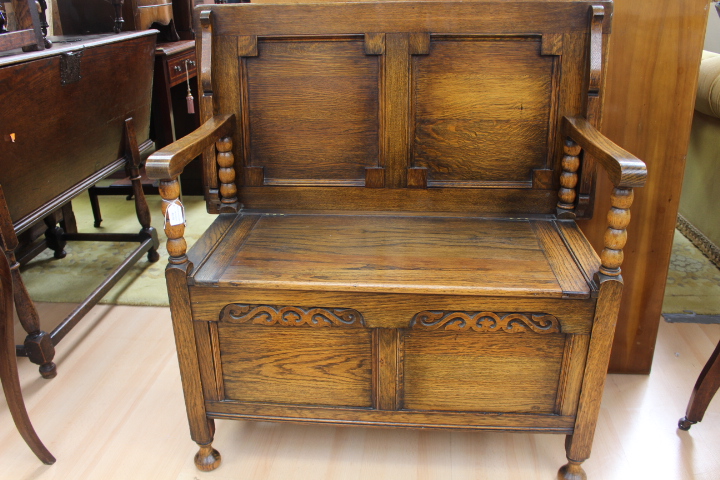 A Monks bench hall seat with flip top,