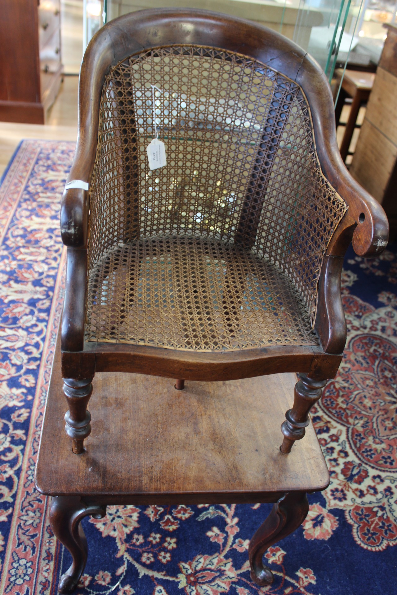 A Victorian mahogany child's high chair on stand, canework seat and back,