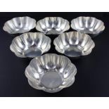 A set of six Islamic white metal circular lobed bowls, having octofoil rim, each 5cm high x 13cm