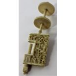 A Chinese Canton carved ivory sewing clamp, late 19th century, the clamp jaw deeply carved with