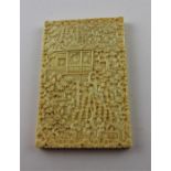 A Chinese Canton carved ivory card case, late 19th century, of rectangular form, profusely carved to