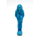 Egyptian Ptolemaic Period Faience Shabti C. 4th Century BC. A bright blue faience mummiform