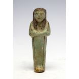 Egyptian Faience Shabti Figure Third Intermediate Period, C. 718 BC. A faience figure in the form of