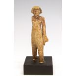 Egyptian Wooden Oarsman Middle Kingdom, 2000 BC. A wooden figure of a standing oarsman with right