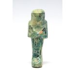 Egyptian Faience Shabti Figure Third Intermediate Period, C. 730 BC. A dark green glazed faience