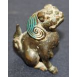 A Ming Dynasty scholars weight in the form of a temple dog, with painted detail, 8cm high,