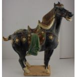 **REOFFER JAN ETWALL £100/£150** A Tang Dynasty style Sancai glazed pottery horse, 50cm high.