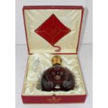 A boxed Remy Martin Louis X111 Grande Champagne Cognac, in Baccarat glass decanter and stopper.