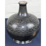 **REOFFER JAN ETWALL £40/£60** An interesting Islamic terracotta vessel, with silver wirework and