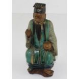 **REOFFER JAN ETWALL £30/£40** A Chinese Ming Dynasty style pottery figure of a seated elder,