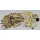 **REOFFER JAN ETWALL £20/£30** A Chinese ivory bead necklace, together with an ivory clamp/pin