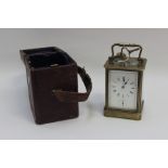 Victorian brass skeleton movement carriage clock with key and fitted Ox blood leather case (with