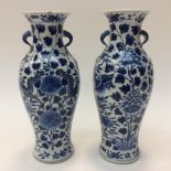 A pair of blue and white Chinese twin handled vases,