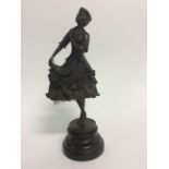 A Bronze figure of a Lady. 31cm in height.