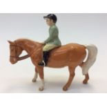 A Beswick horse and rider