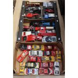 Three trays of modern diecast vehicles by Bburago,