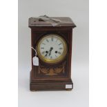 An Edwardian mahogany mantel clock with Roman numerals,