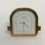 A Hermes Paris bedside clock, fold flat for travel, heavily Gold plated, Swiss mechanism,