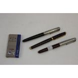 Three Parker pens,