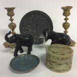 A pair of Indian ebony elephants, a carved soapstone box and cover,