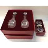 Baccarat boxed oil and vinegar bottles (with stoppers) with boxed Baccarat pair of salts,