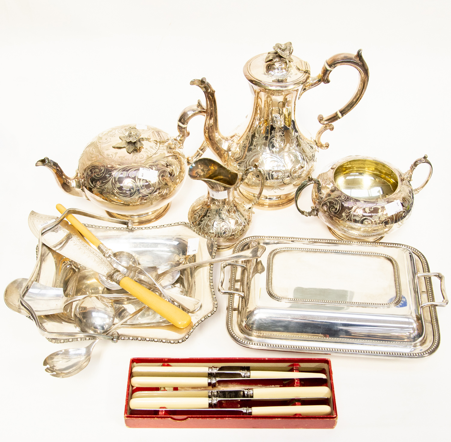 A four piece 20th Century stainless tea set with other items