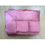 A 3/4 to double bed quilted eider down, early 1950's in dusty pink/rose pink.