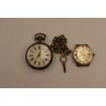 A French white metal Hunter, enameled dial and white metal chain,