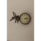 A silver cased pocket watch with keys,