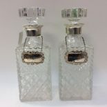 Two cut glass 20th Century decanters with London silver marks on rim and whisky and sherry labels