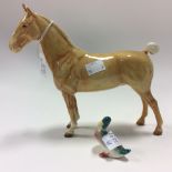 A Beswick Palomino Cob with docked tail and a small Beswick mallard (2)