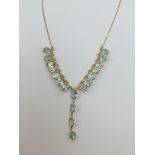 A 14ct gold and aquamarine necklace,