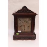 A late Victorian mahogany mantle clock,