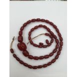 A dyed cherry amber bead necklace, with graduated beads, total gross weight approx 86.