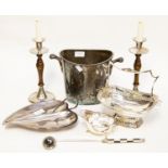 A champagne/wine bucket, pair of candlesticks, candle snuffer, serving dishes,