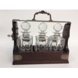 A 20th Century tantalus with triple glass decanter