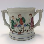 An early 19th century pearlware twin handled mug,