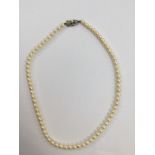 A boxed single row of Mikimoto cultured pearls necklace, 5.